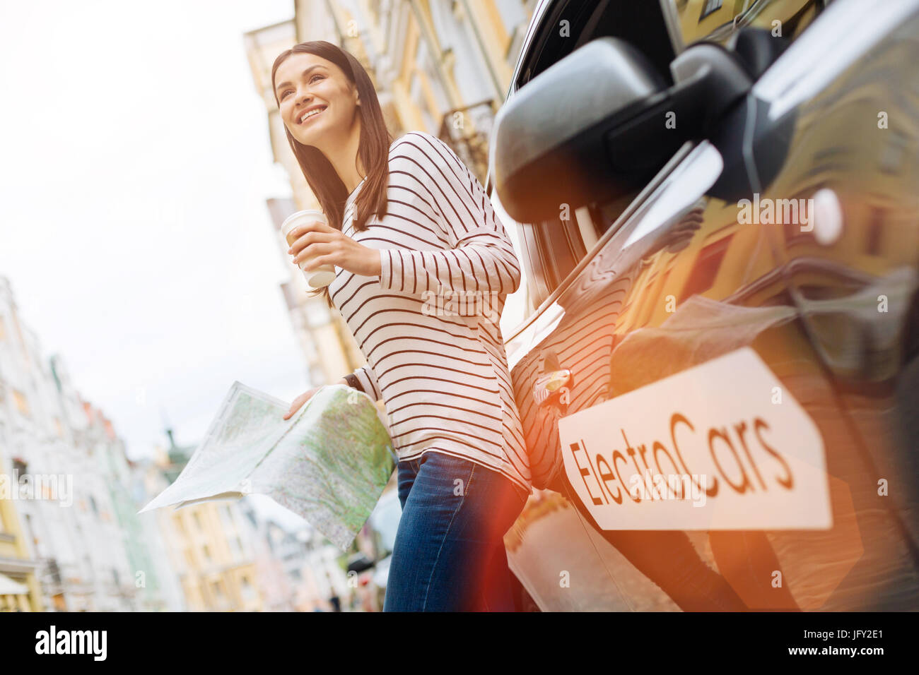 Lovely woman being happy about her new journey Stock Photo