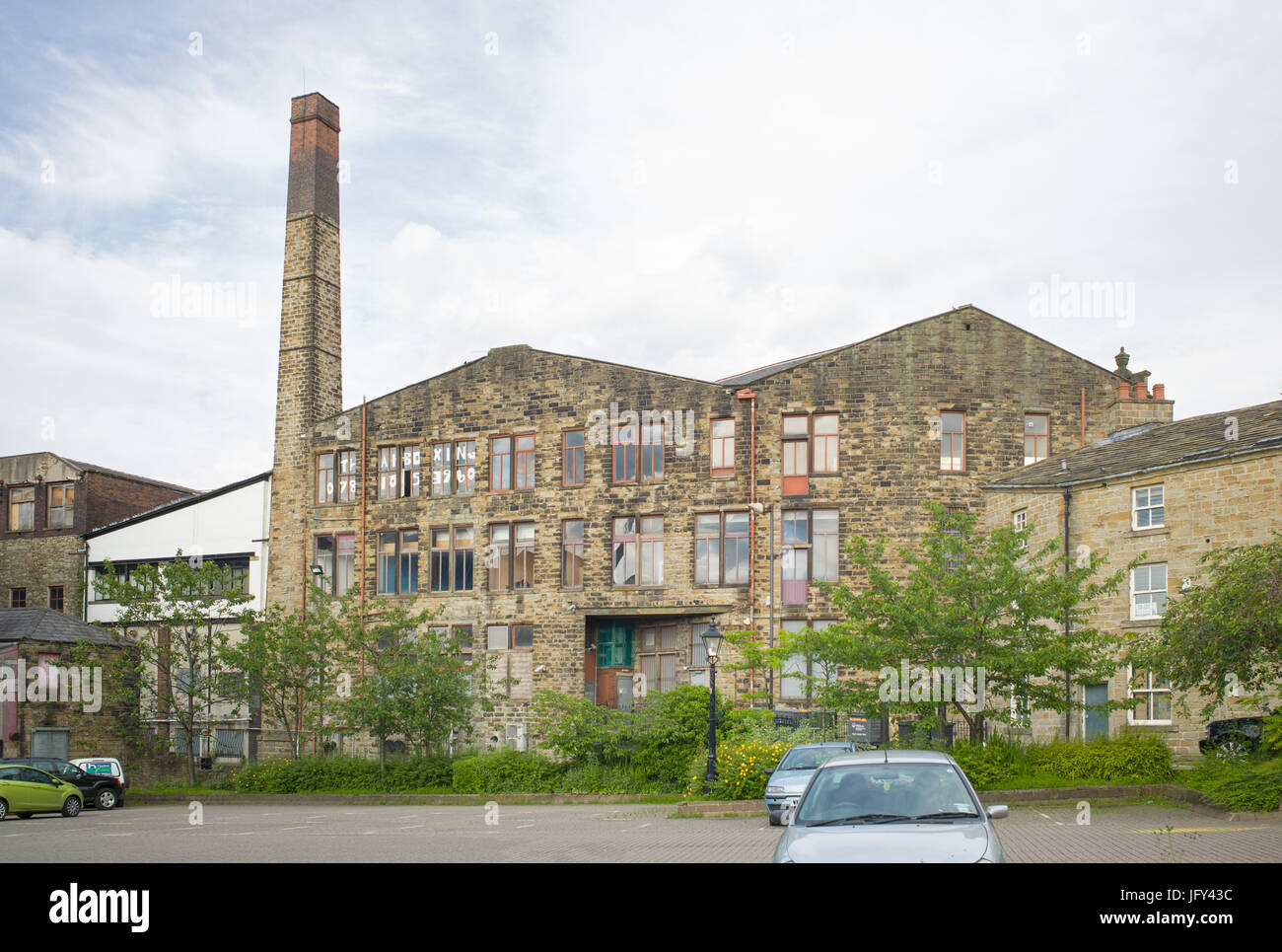 chimney-of-former-mill-with-building-repurposed-and-occupied-as