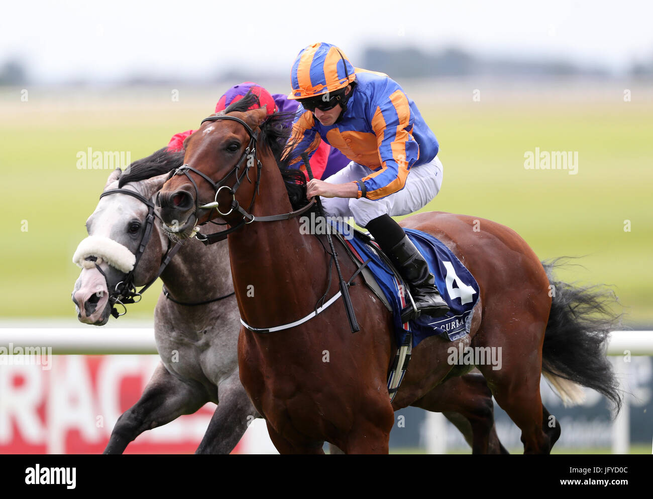 Johannes Vermeer ridden by Ryan Moore (front) before winning the Finlay Volvo International Stakes ahead of Success Days ridden by Shane Foley during day three of the Dubai Duty Free Irish Derby Festival at Curragh Racecourse, Co. Kildare. Stock Photo