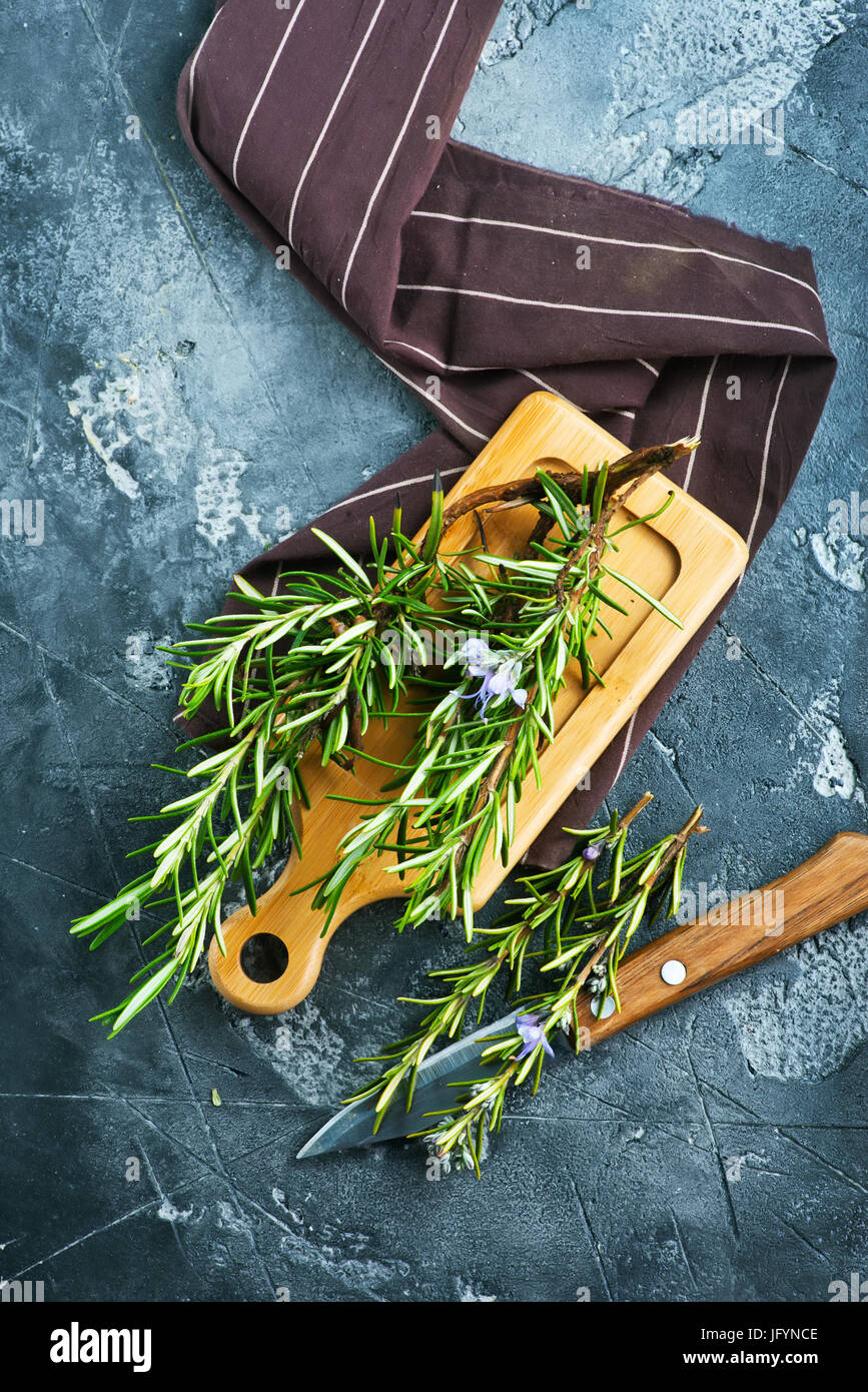 fresh rosemary, herb on the wooden table Stock Photo