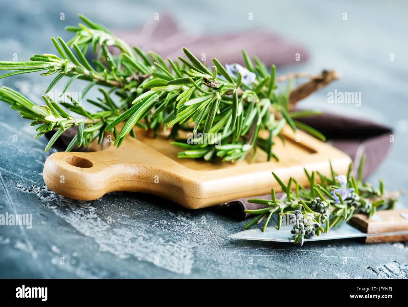 fresh rosemary, herb on the wooden table Stock Photo
