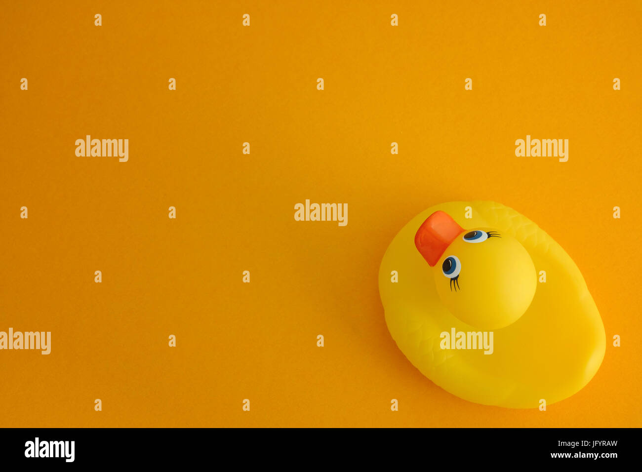 Yellow rubber duck on yellow background. Close up Stock Photo - Alamy