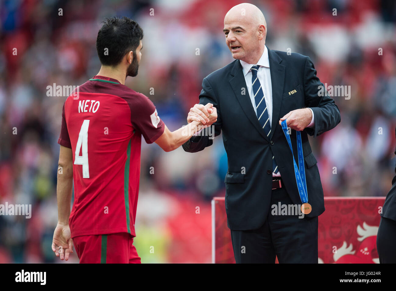 Moscow, Russia. 2nd July, 2017. President of FIFA Gianni Infantino (R) celebrates Luis Neto of Portugal with a bronze medal after the bronze match of Confederations Cup-2017 in Moscow, Russia, on July 2, 2017. Credit: Evgeny Sinitsyn/Xinhua/Alamy Live News Stock Photo