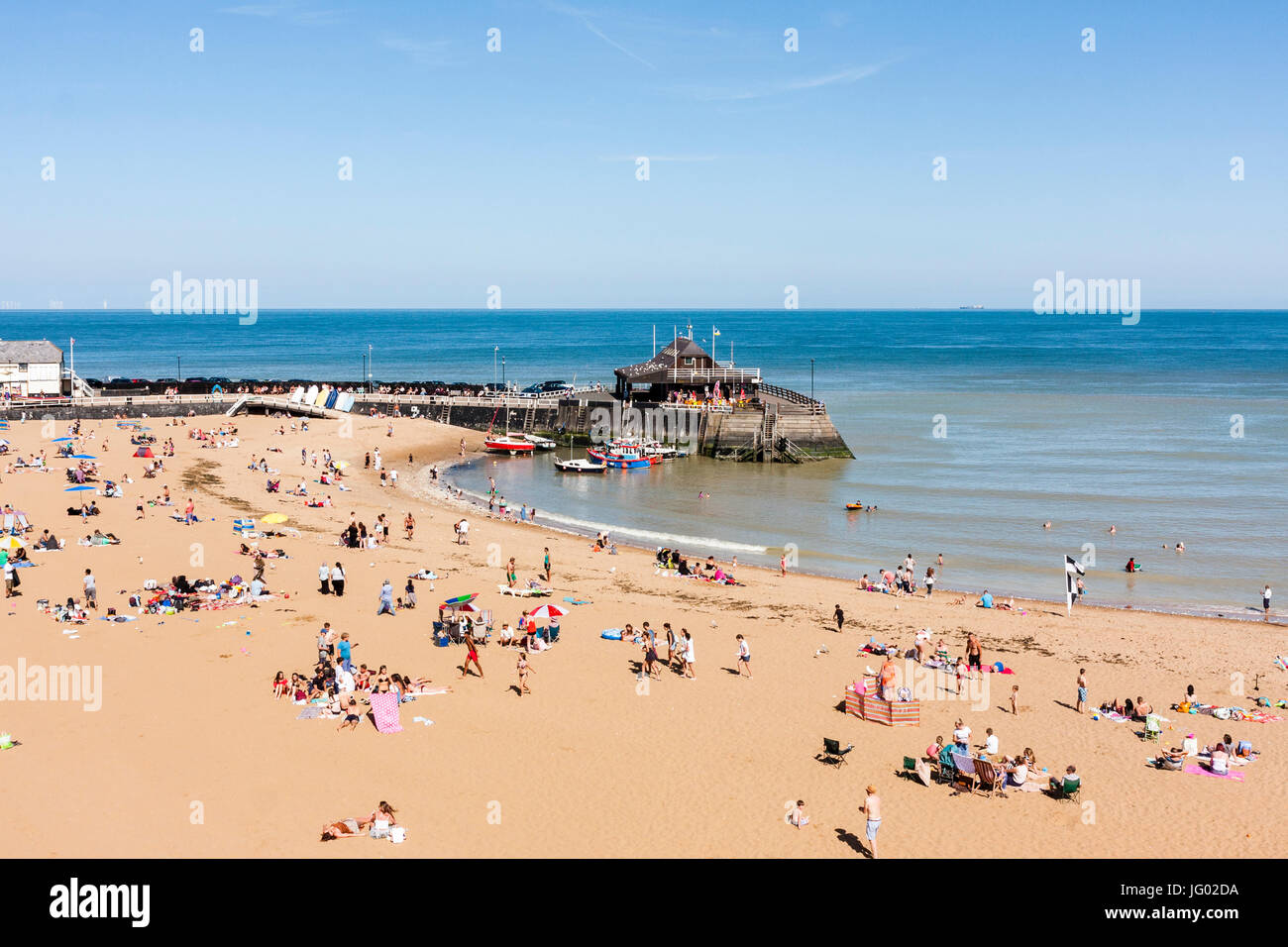 Aerial view of Broadstairs popular Viking Bay and harbour. Bright sunshine with many people on