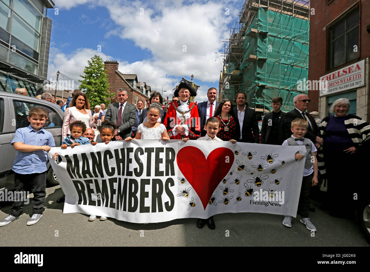 Manchester, UK. 2nd July, 2017. . The Italian Madonna del Rosario procession prepares to leave Ancoats led by The Lord Mayor and Children with a banner which reads "Manchester Remembers",  Manchester,2nd July, 2017  Credit: Barbara Cook/Alamy Live News Stock Photo