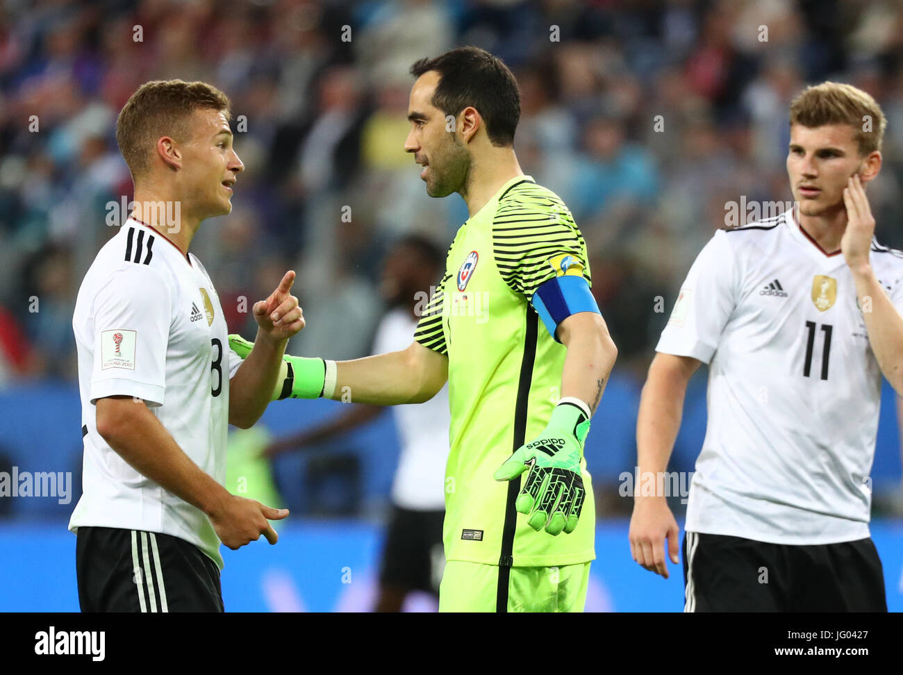 Saint Petersburg, Russia. 2nd July, 2017. Chile's Claudio Bravo (c) and Germany's Joshua Kimmich speak during the Confederations Cup finale between Chile and Germany at the Saint Petersburg Stadium in Saint Petersburg, Russia, 2 July 2017. Photo: Christian Charisius/dpa/Alamy Live News Stock Photo