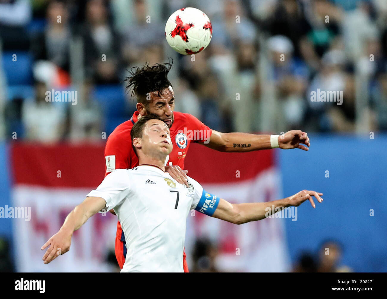 St. Petersburg, Russia. 2nd July, 2017. Julian Draxler (Front) of Germany heads the ball with Mauricio Isla of Chile during the final match between Chile and Germany at the 2017 FIFA Confederations Cup in St. Petersburg, Russia, on July 2, 2017. Germany claimed the title by defeating Chile with 1-0. Credit: Wu Zhuang/Xinhua/Alamy Live News Stock Photo