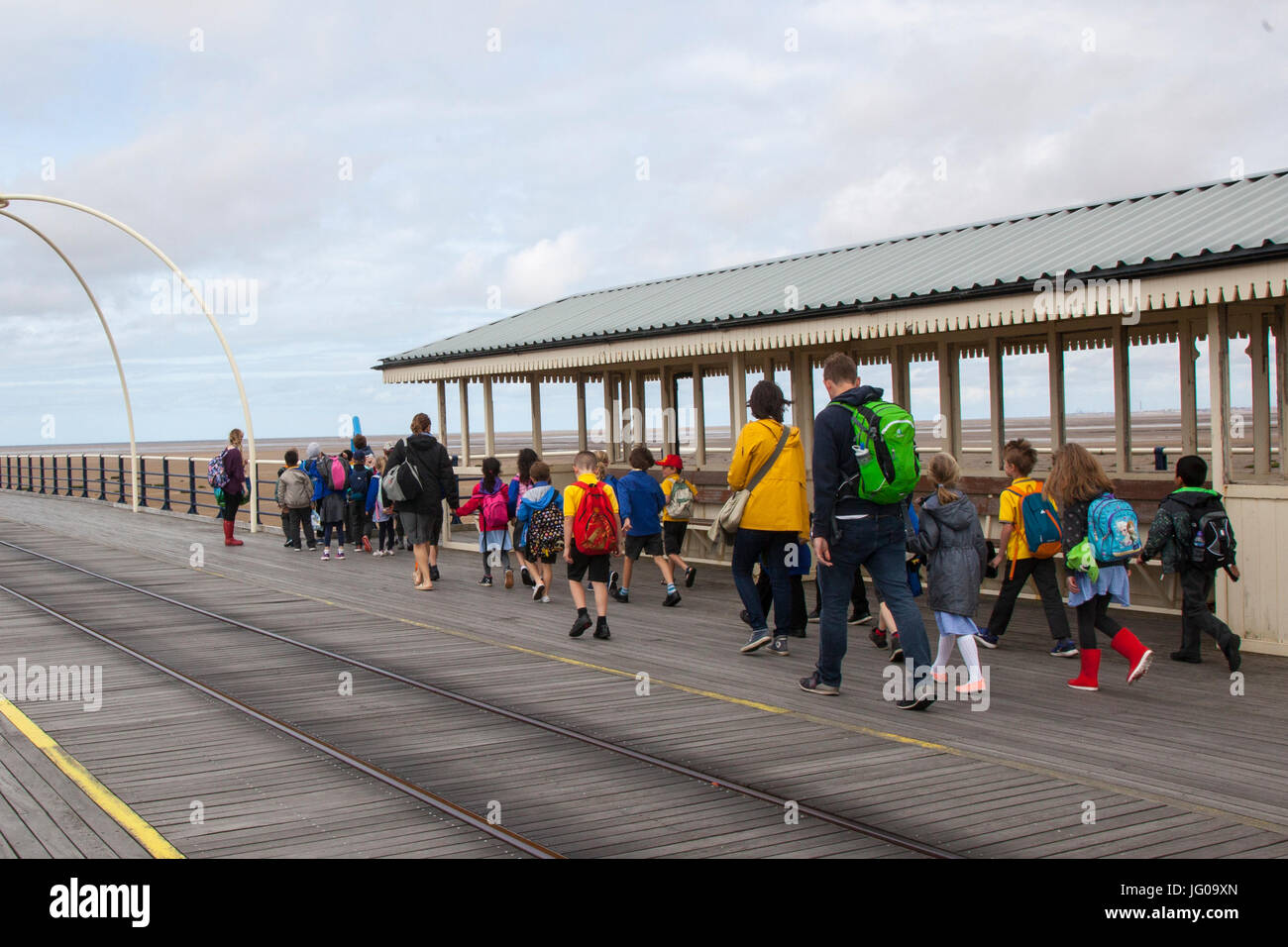 Southport, Merseyside, UK. 3rd July, 2017.   UK Weather. School Children enjoy a day out on Southport Pier. School trips from Wigan and surrounding district bring children to the resort on an educational outing to explore the coast and learn about the marine environment, tides and wildlife in the seaside town. Credit; MediaWorldImages/AlamyLiveNews. Stock Photo