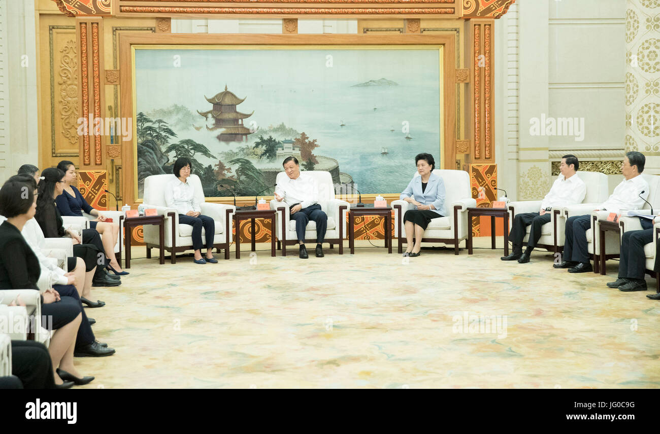 Beijing, China. 3rd July, 2017. Liu Yunshan (4th R), a member of the Standing Committee of the Political Bureau of the Communist Party of China (CPC) Central Committee, meets with a delegation reporting exemplary deeds of late geophysicist Huang Danian, who is honored as a 'national outstanding CPC member,' in Beijing, capital of China, July 3, 2017. Credit: Huang Jingwen/Xinhua/Alamy Live News Stock Photo