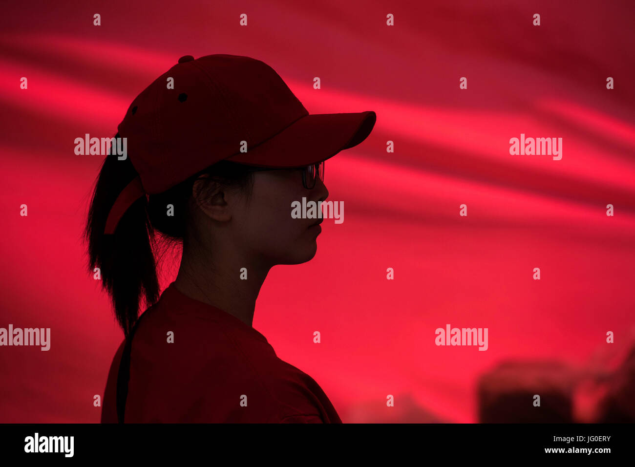 Silhouette of a young Asian fast food worker Stock Photo