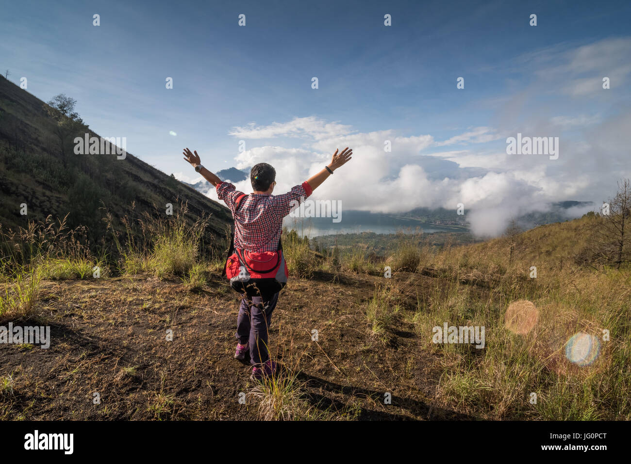 hikers standing on top of the mountain and enjoying view Stock Photo ...