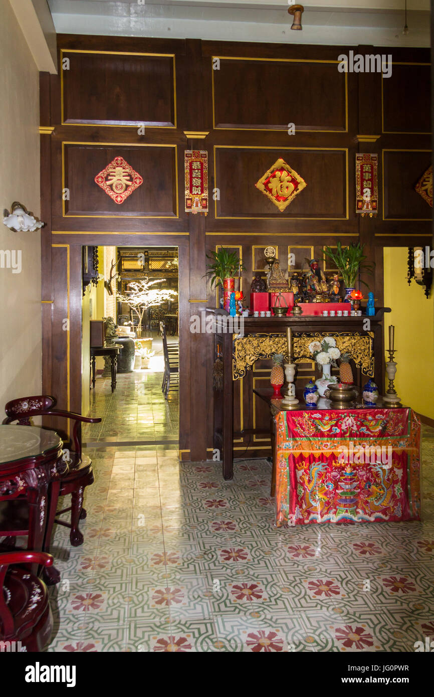 Interior of house with shrine in Thalang Road in old Phuket Town, Thailand Stock Photo
