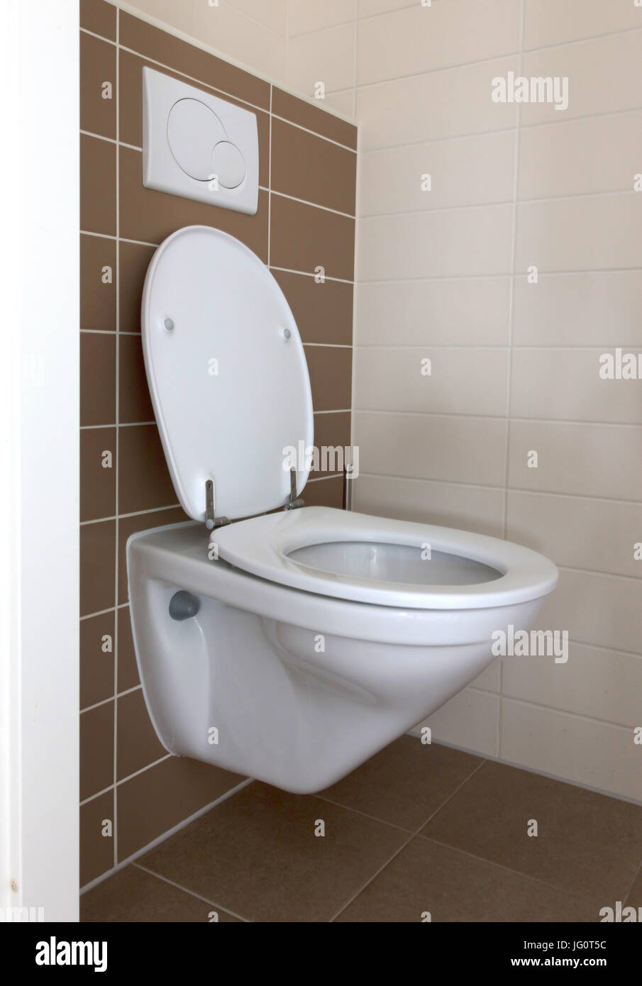Modern white toilet bowl in the bathroom Stock Photo - Alamy