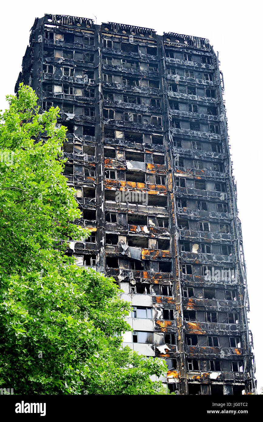 The Grenfell Tower - Fire disaster which ripped through the building leaving hundreds homeless and many dead, now stands black and burnt. Stock Photo