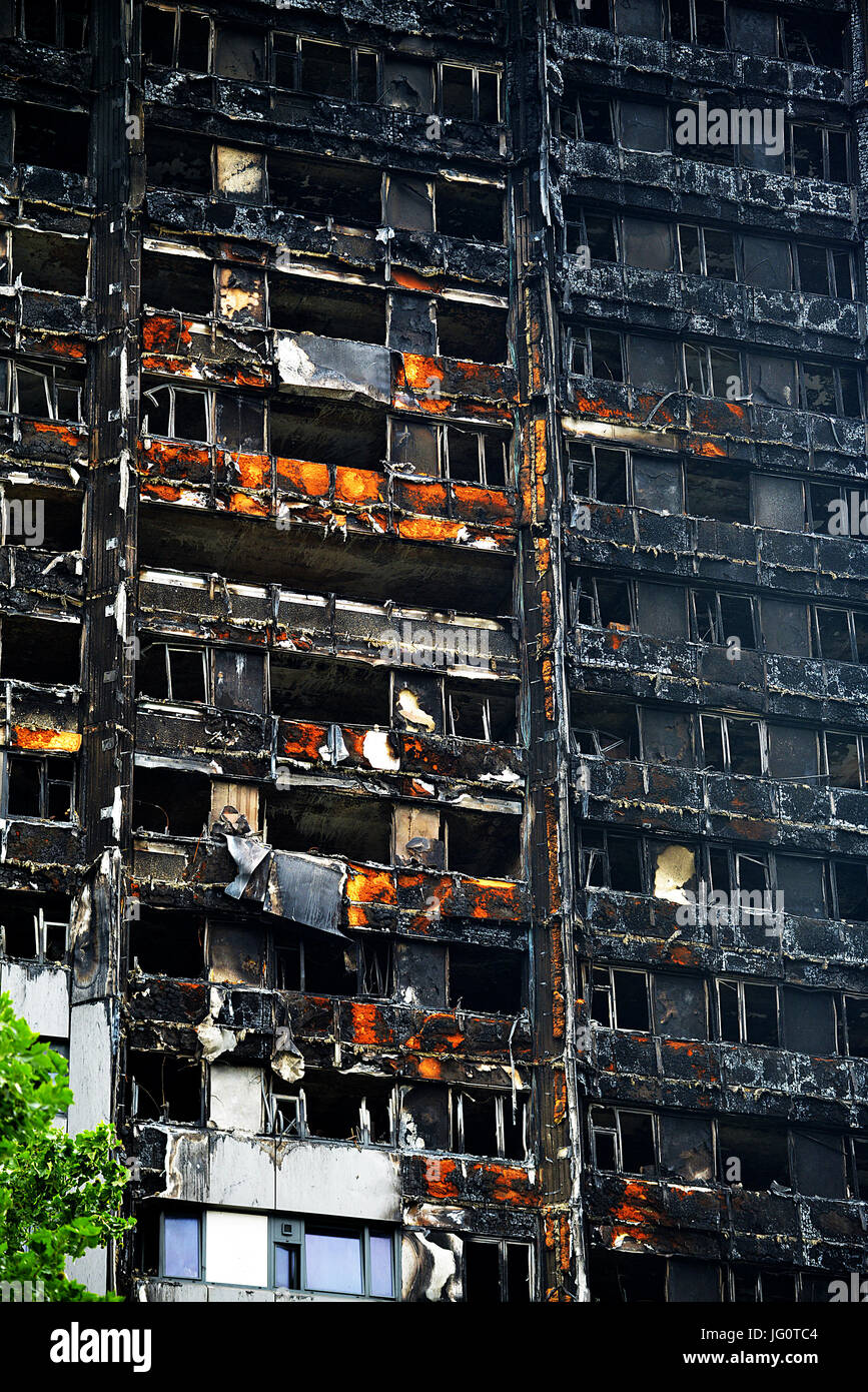 The Grenfell Tower - Fire disaster which ripped through the building leaving hundreds homeless and many dead, now stands black and burnt. Stock Photo