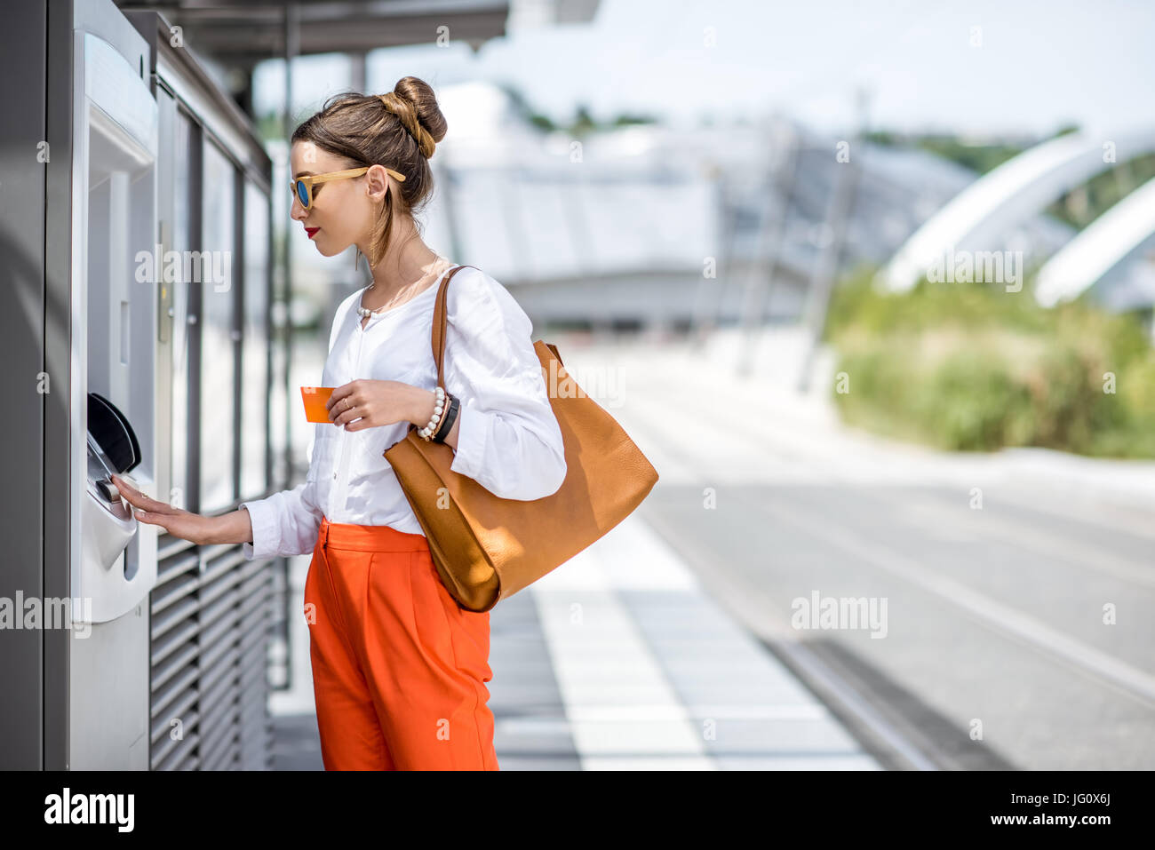 Woman train ticket machine hi-res stock photography and images - Alamy