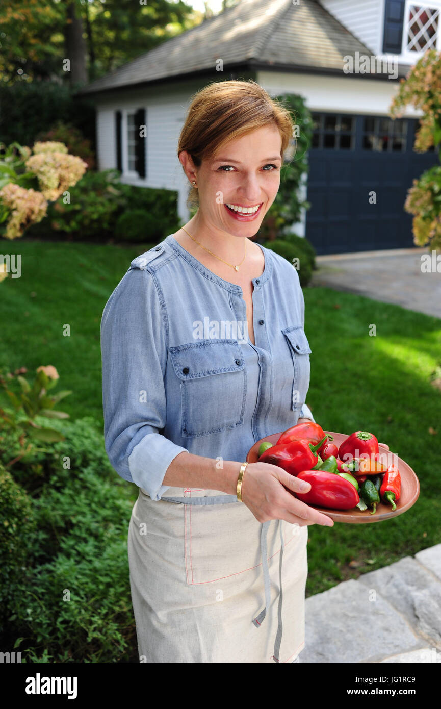 Celebrity Mexican American TV chef Pati Jinich author of cookbooks and Show on PBS Pati's Mexican Table - at home - Stock Photo