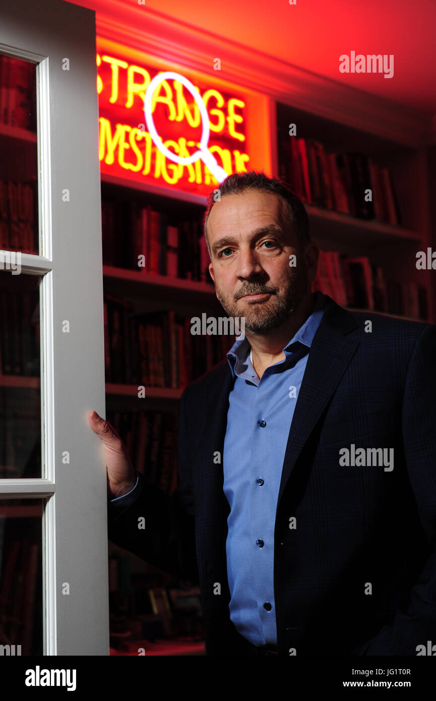 George Pelecanos in his home in Maryland Author writer TV director crime mystery Stock Photo