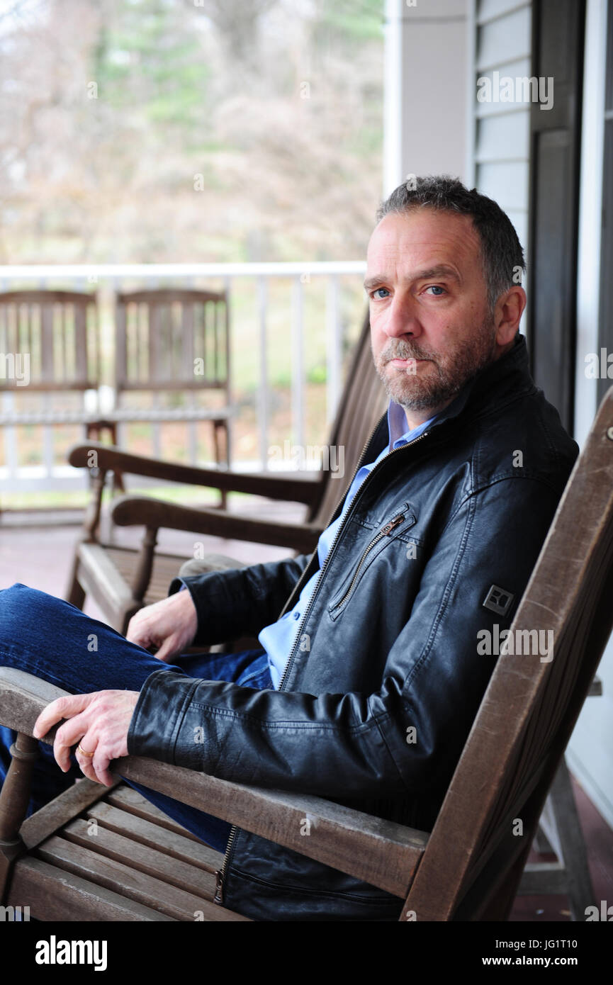 George Pelecanos in his home in Maryland Author writer TV director crime mystery Stock Photo