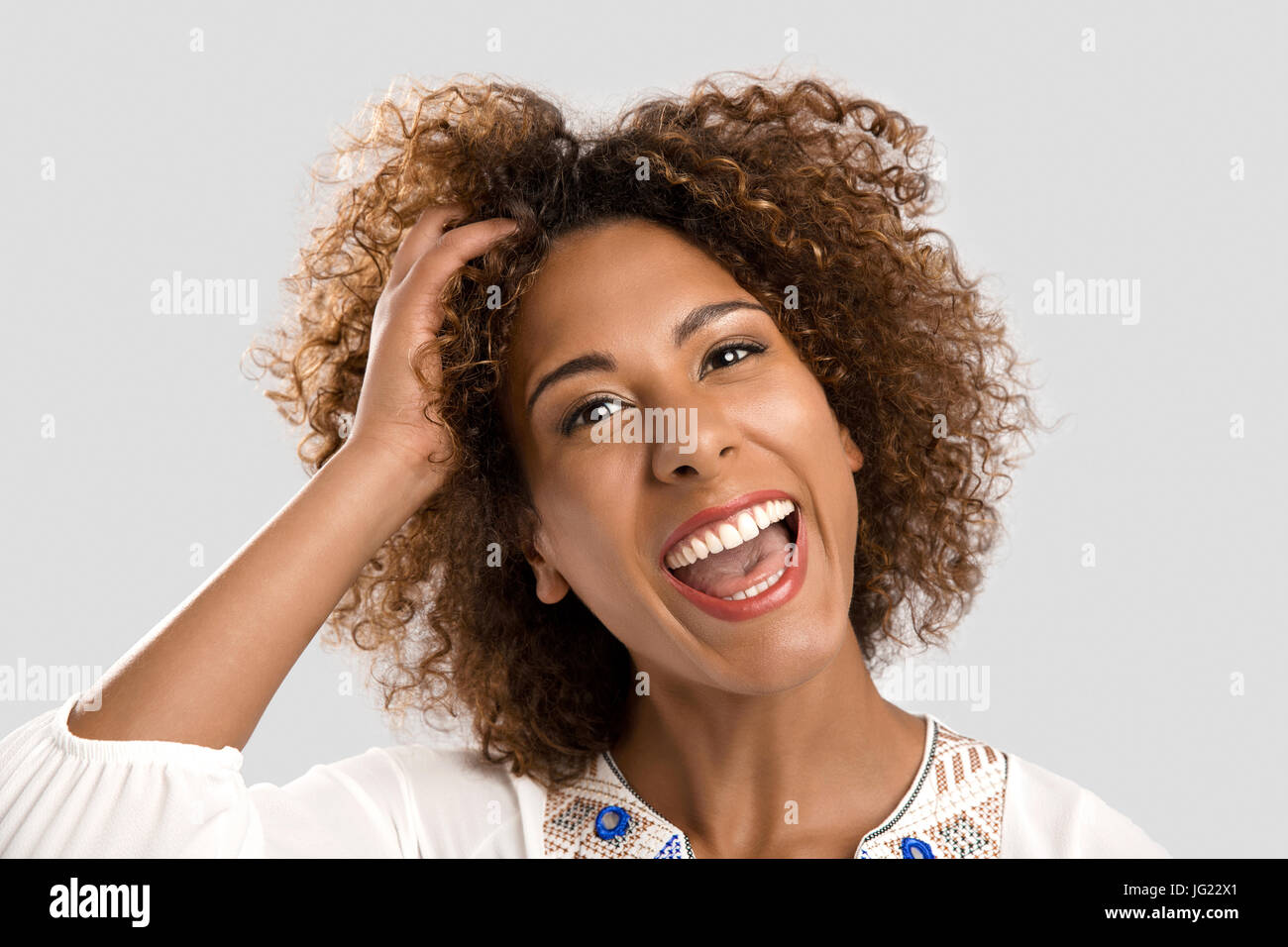 Portrait of a beautiful African American woman laughing Stock Photo