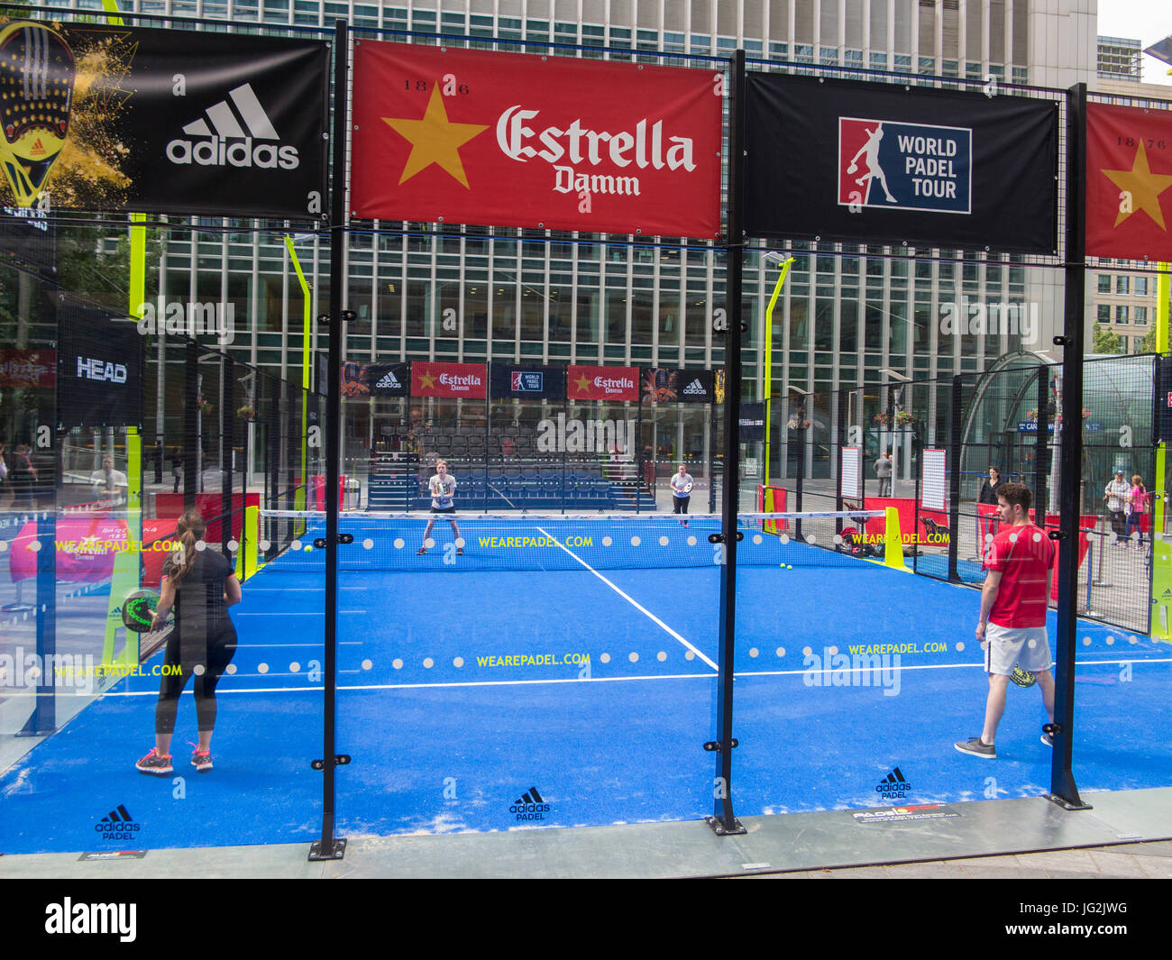 Padel tennis in the Docklands area of London, surrounded by high rise offices Stock Photo