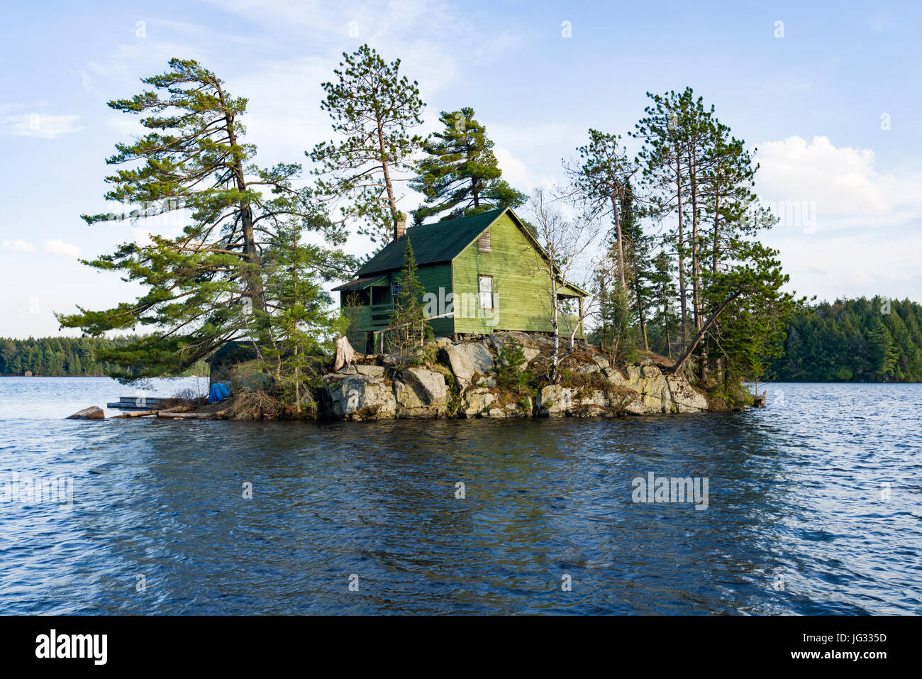 Wooden House On Small Island Surrounded By Trees And Lake, Algonquin Provincial Park, Ontario, Canada Stock Photo