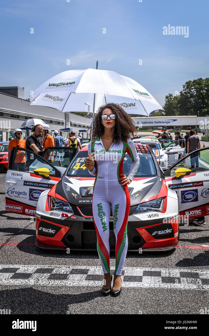 Seat Leon Cupra Cup beautiful young grid girl with glasses and umbrella portrait on start finish line Stock Photo