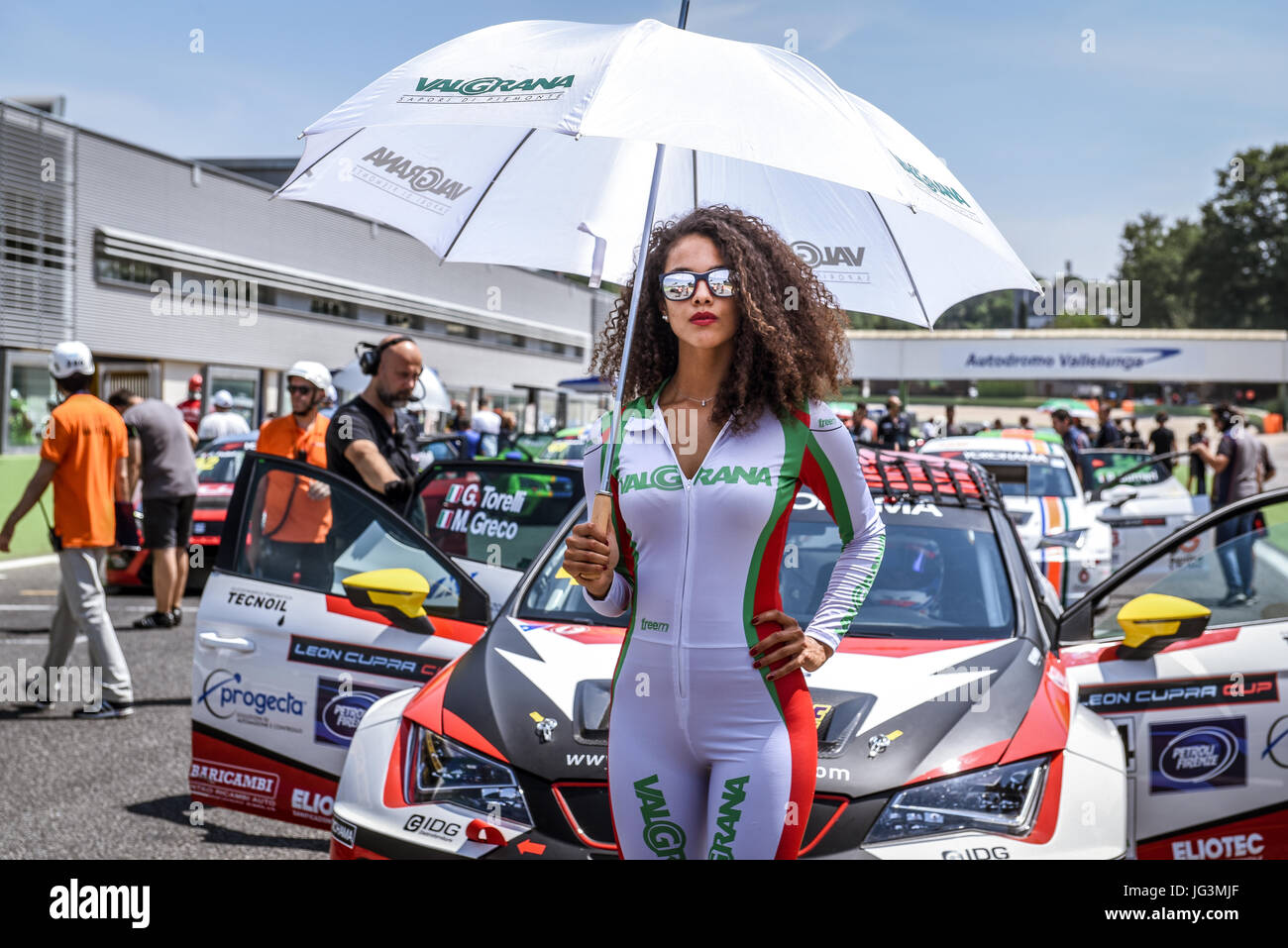 Seat Leon Cupra Cup beautiful young grid girl with glasses and umbrella portrait on start finish line Stock Photo