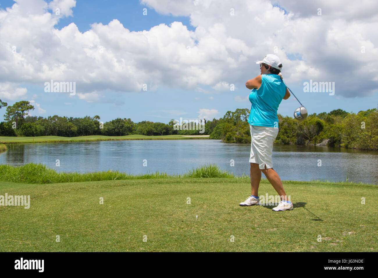 Golfer Hitting Ball on Beautiful Golf Course Stock Photo Alamy