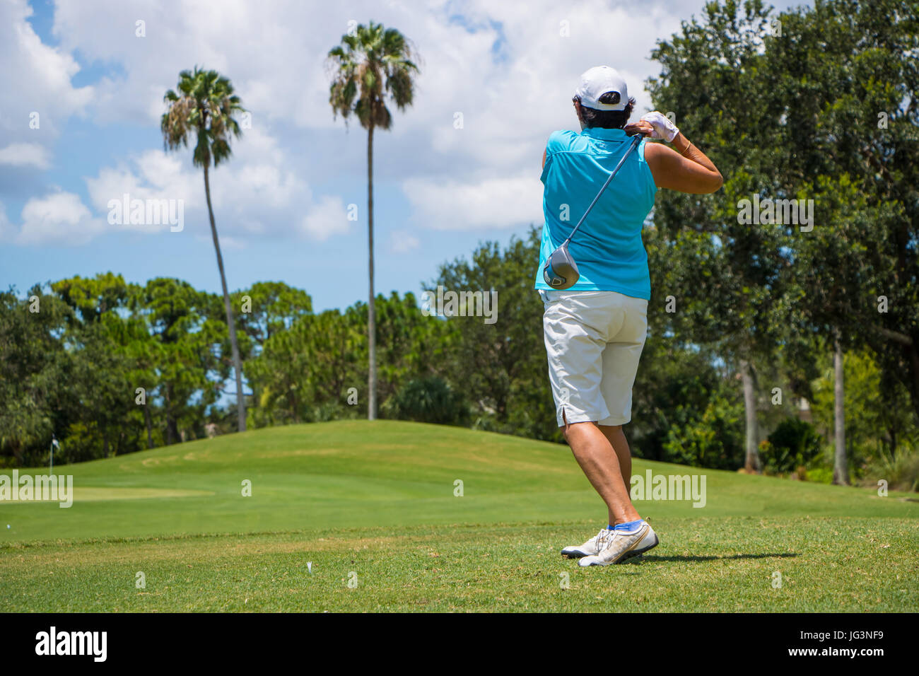 Golfer Hitting Ball on Beautiful Golf Course Stock Photo Alamy