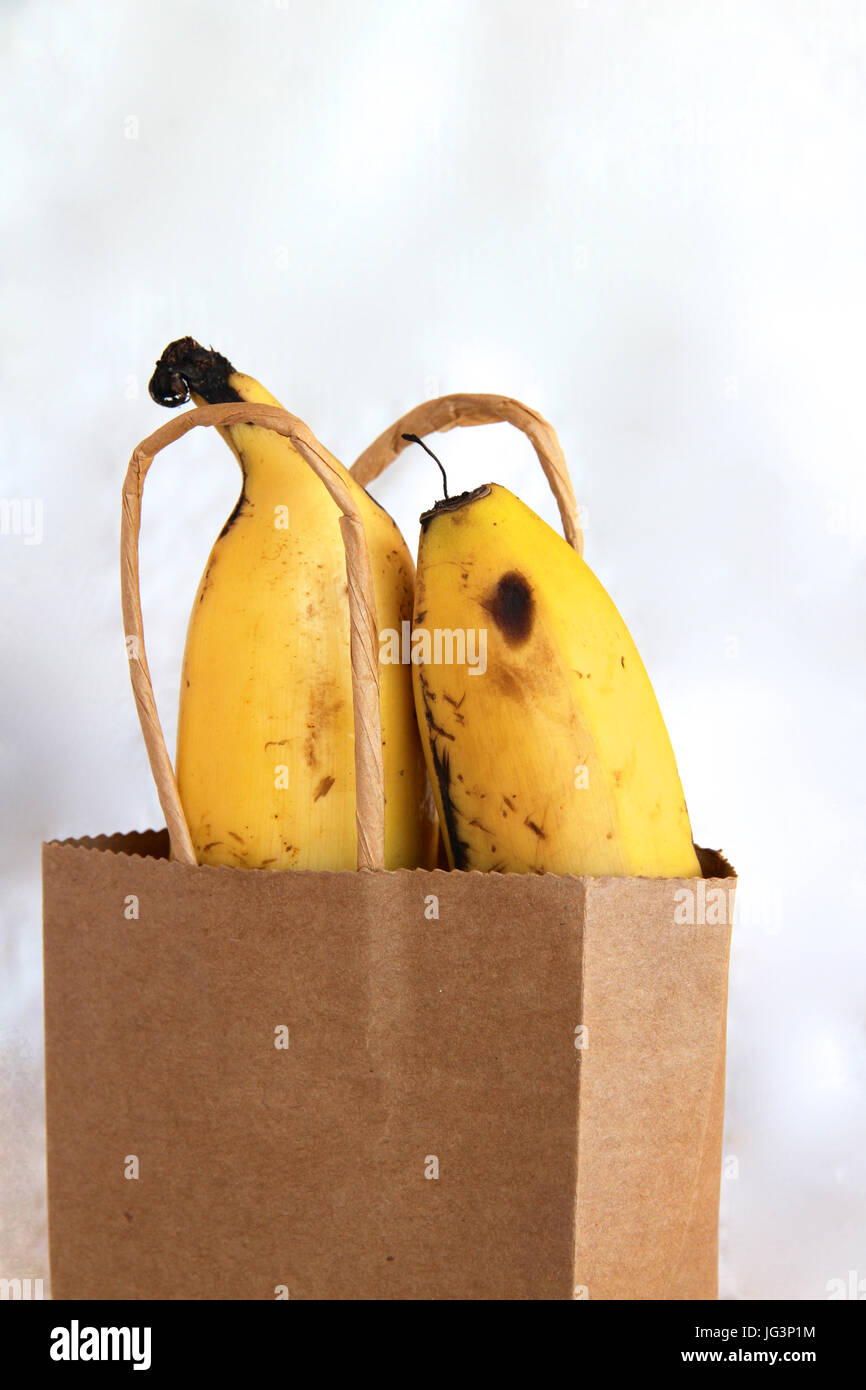 Bananas in a brown paper bag Stock Photo Alamy