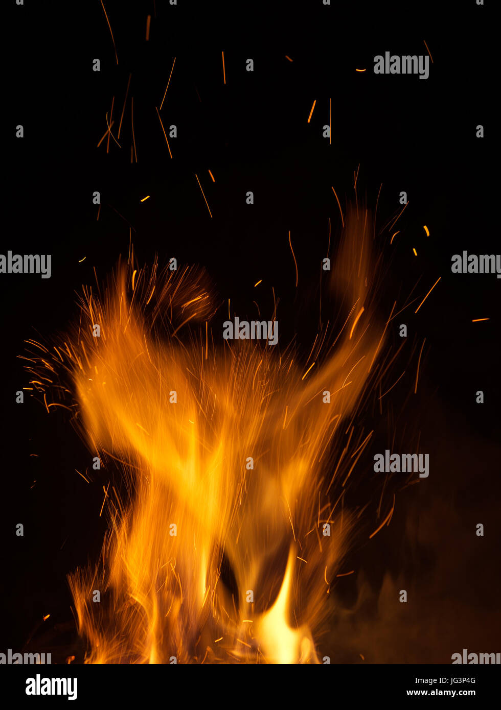 fire flames with sparks on black background Stock Photo - Alamy
