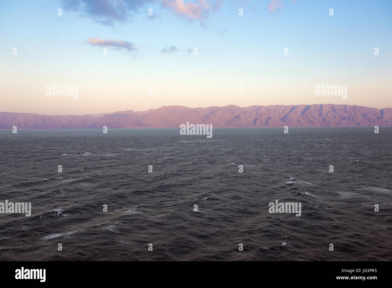 Golden hour over the Sinai Peninsula seen from the Gulf of Aqaba Stock Photo