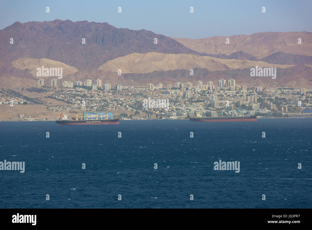 Editorial: EILAT, ISRAEL, April 25, 2017 - Eilat and the mountains of the Sinai seen from Aqaba, Jordan Stock Photo