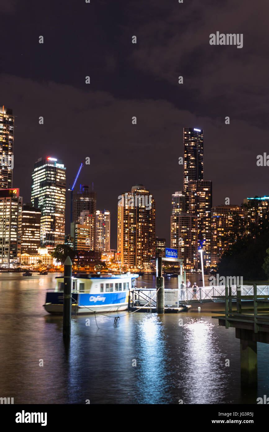 Brisbane city skyline with ferry stop after dark. Queensland. Australia. Stock Photo