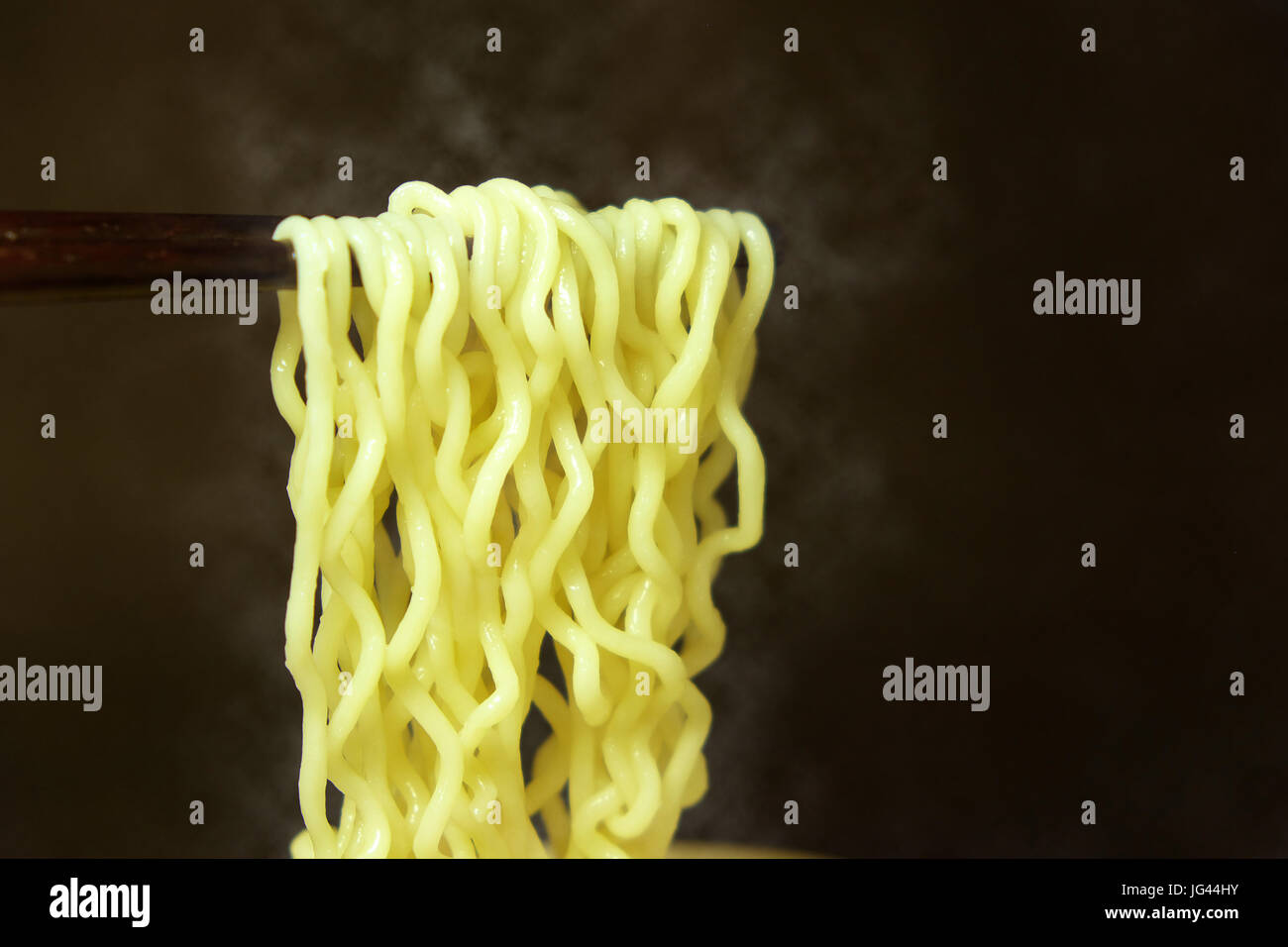 Hot Instant noodle with chopstick, tasty fastfood ready to eat. Stock Photo