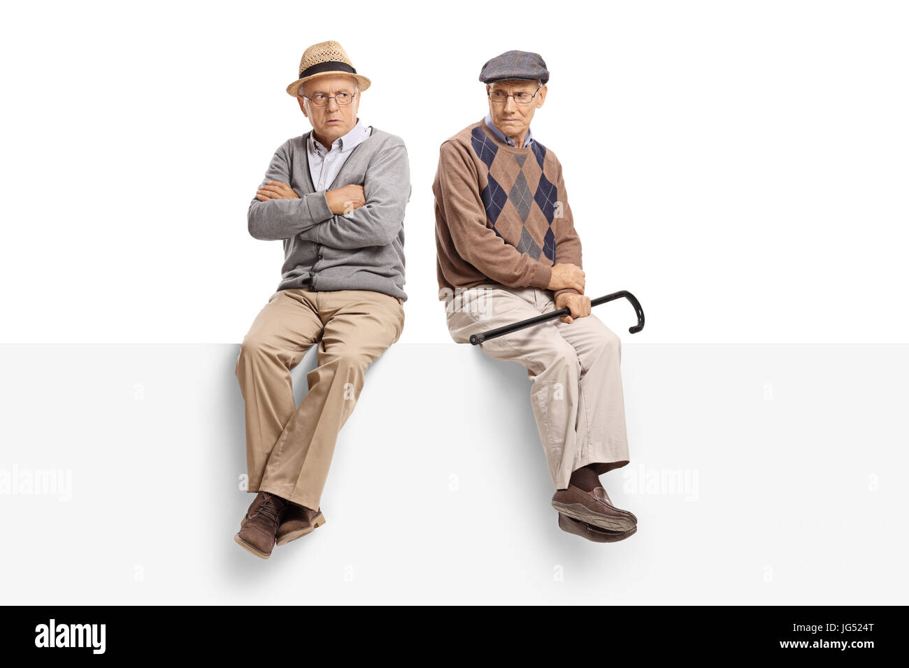 Angry seniors sitting on a panel isolated on white background Stock Photo