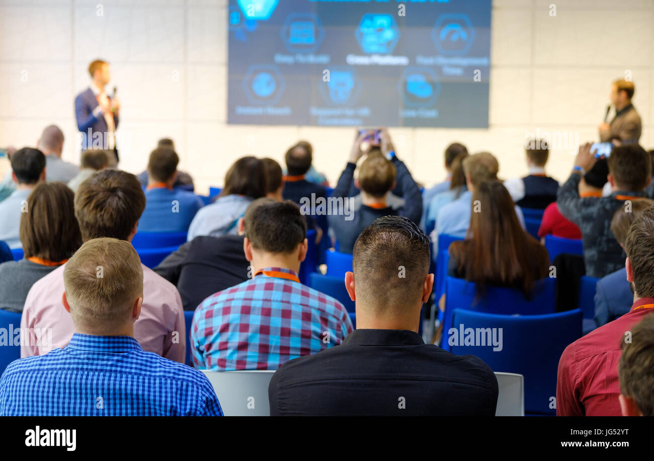 Audience listens to the lecturer Stock Photo - Alamy