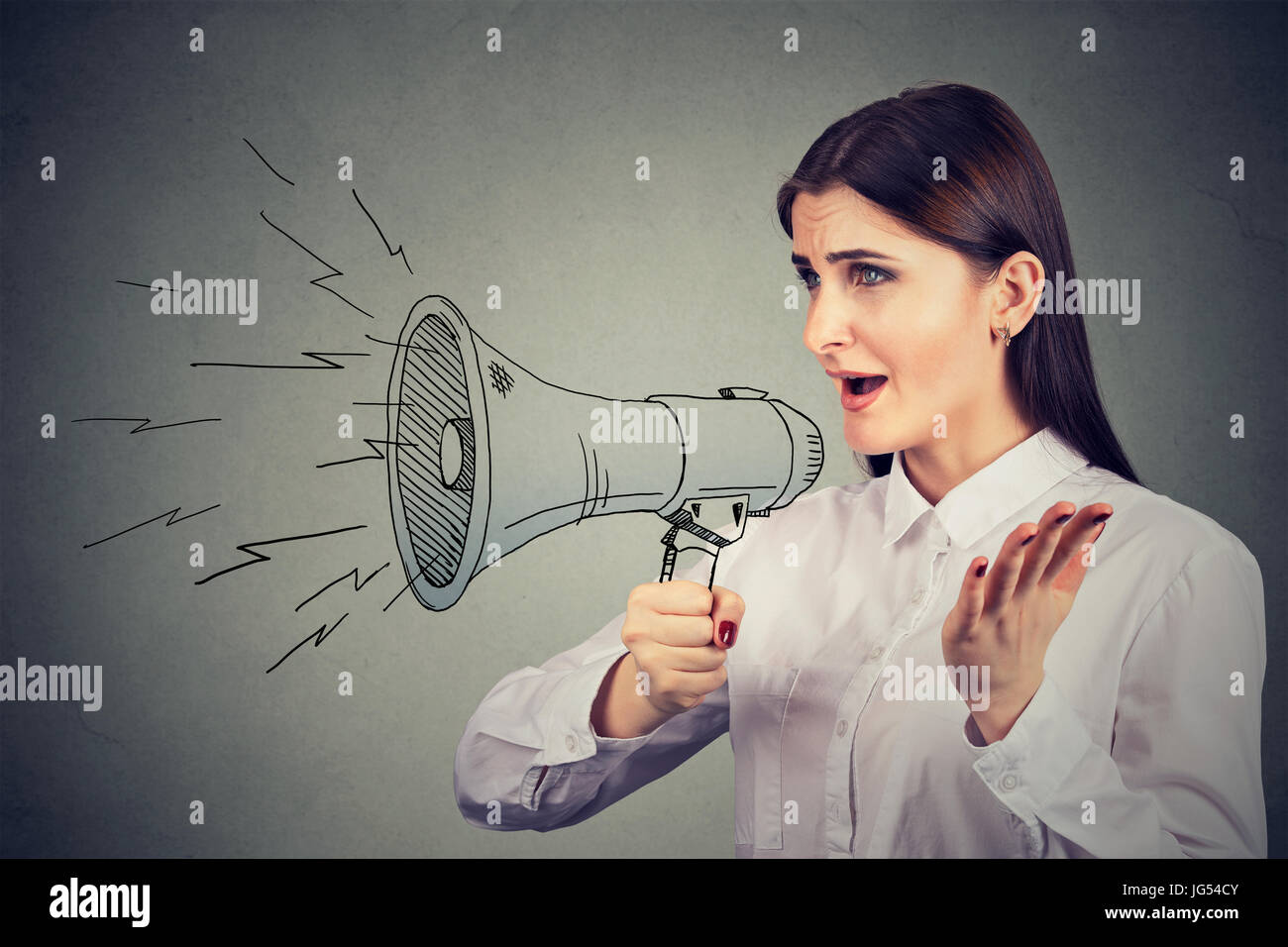 Woman making announcement with megaphone Stock Photo