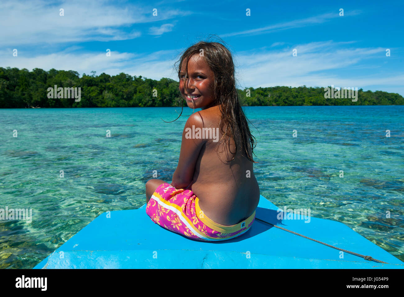 Young salomon girl sitting in front a boat hi-res stock photography and  images - Alamy