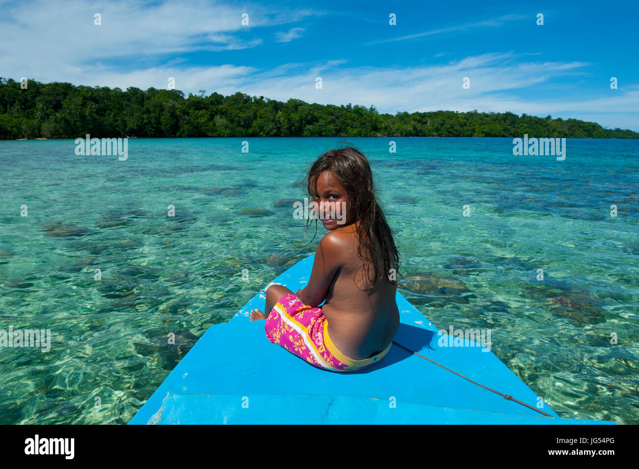 Young salomon girl sitting in front a boat hi-res stock photography and  images - Alamy