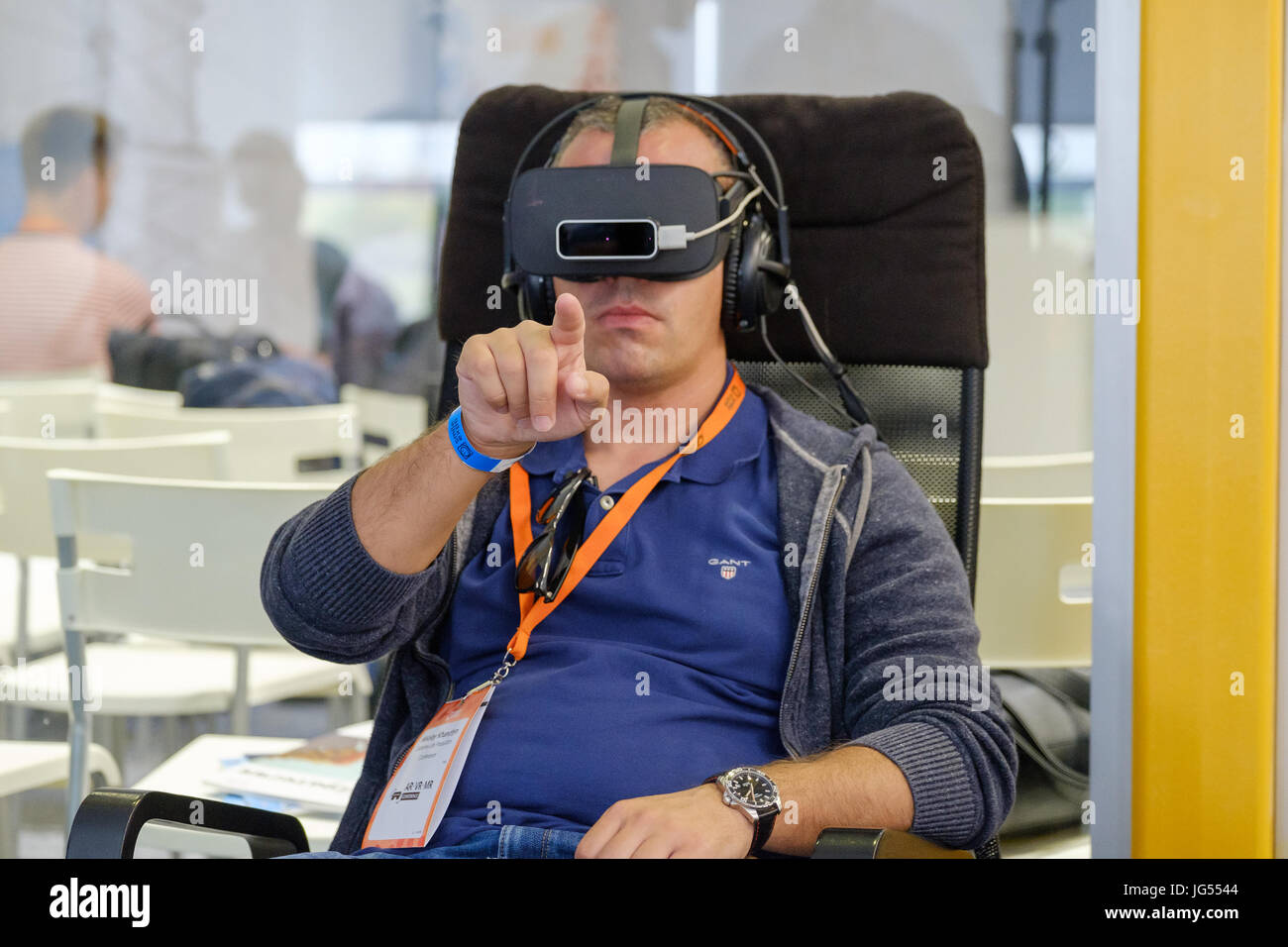 Vr conference visitor tests virtual hi-res stock photography and images ...