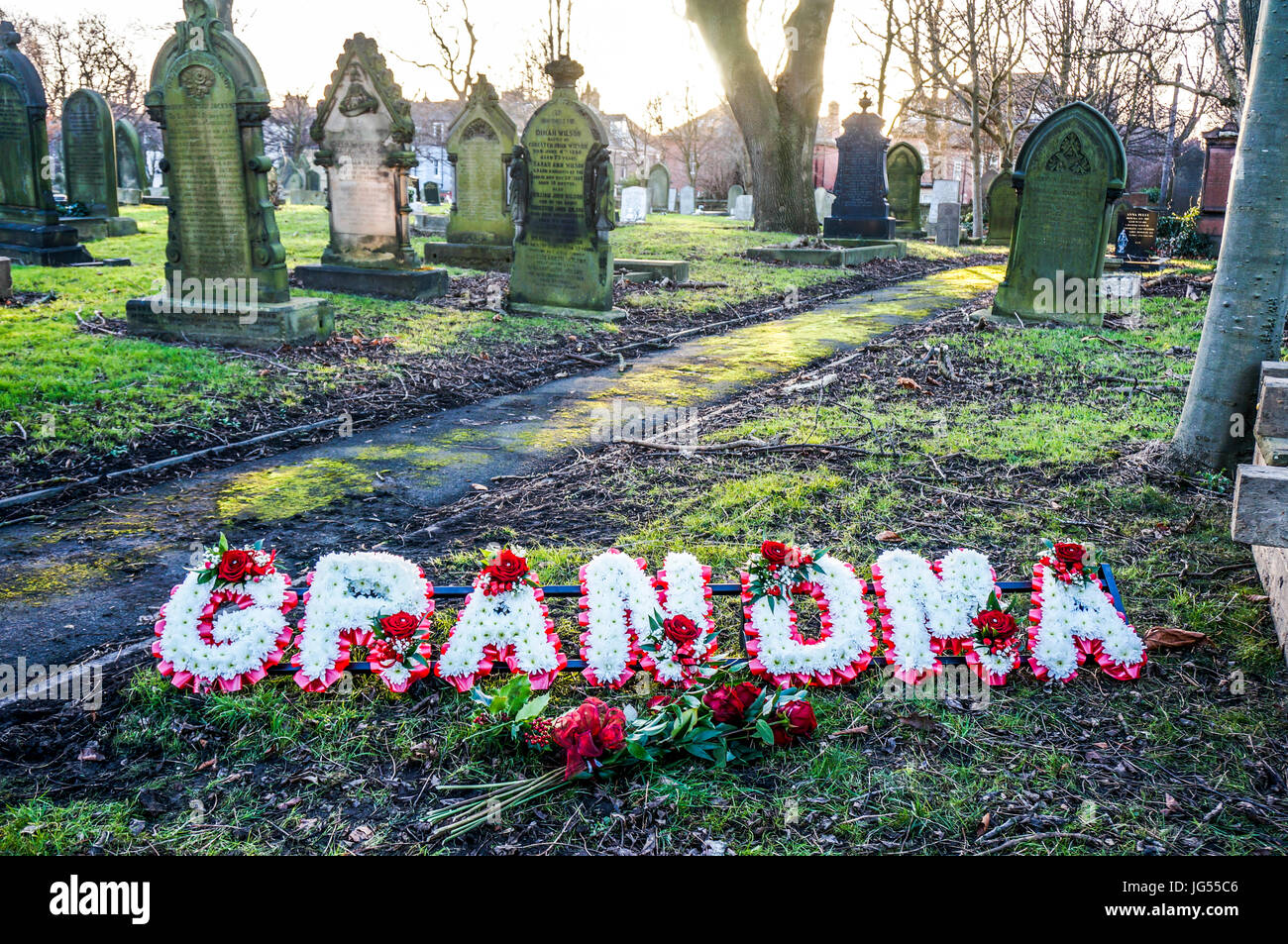 The word 'grandma' in flowers at a cemetery, with old gravestones in the  background. Jesmond cemetery, Newcastle, Tyne and Wear, England, UK Stock  Photo - Alamy