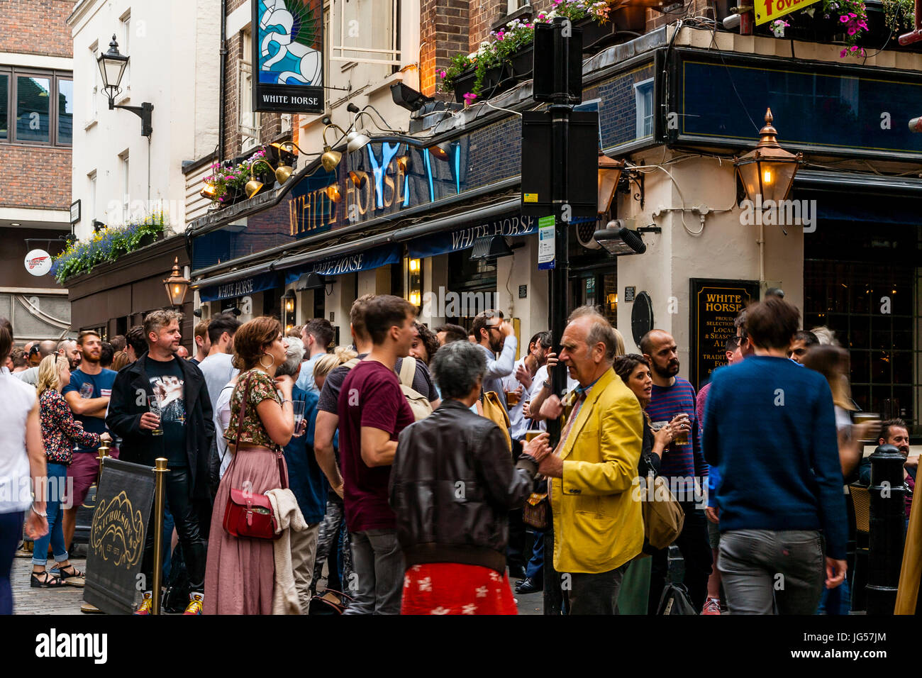 People Drinking Outside The White Horse Pub, Newburgh Street, Off Carnaby Street, London, UK Stock Photo