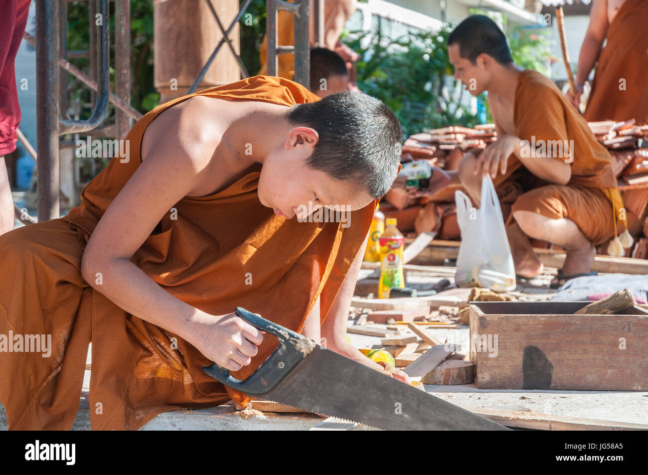 Monks at work -Thailand Stock Photo - Alamy