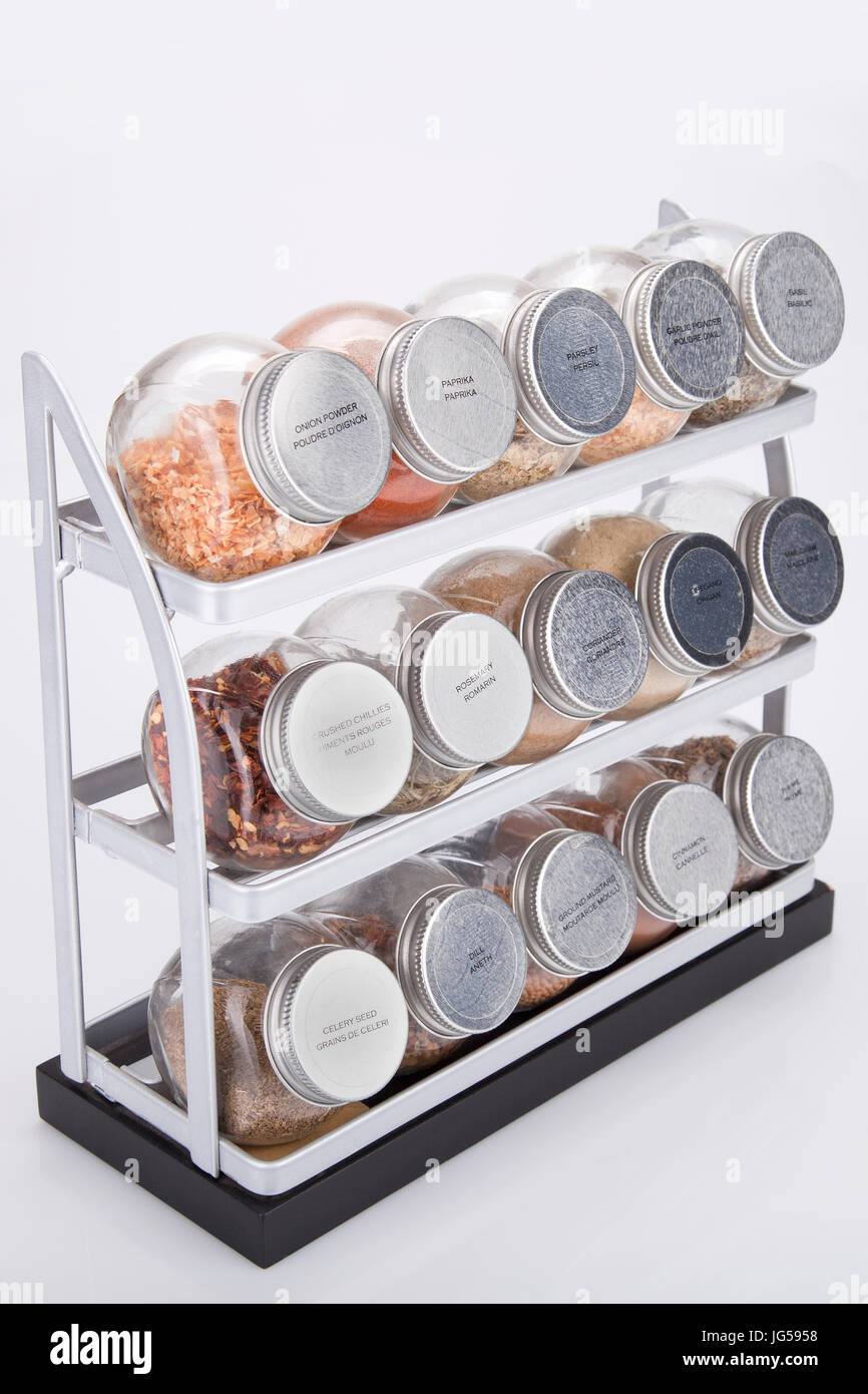 Spices shelves on a white surface. Spice rack isolated on white background. Stock Photo