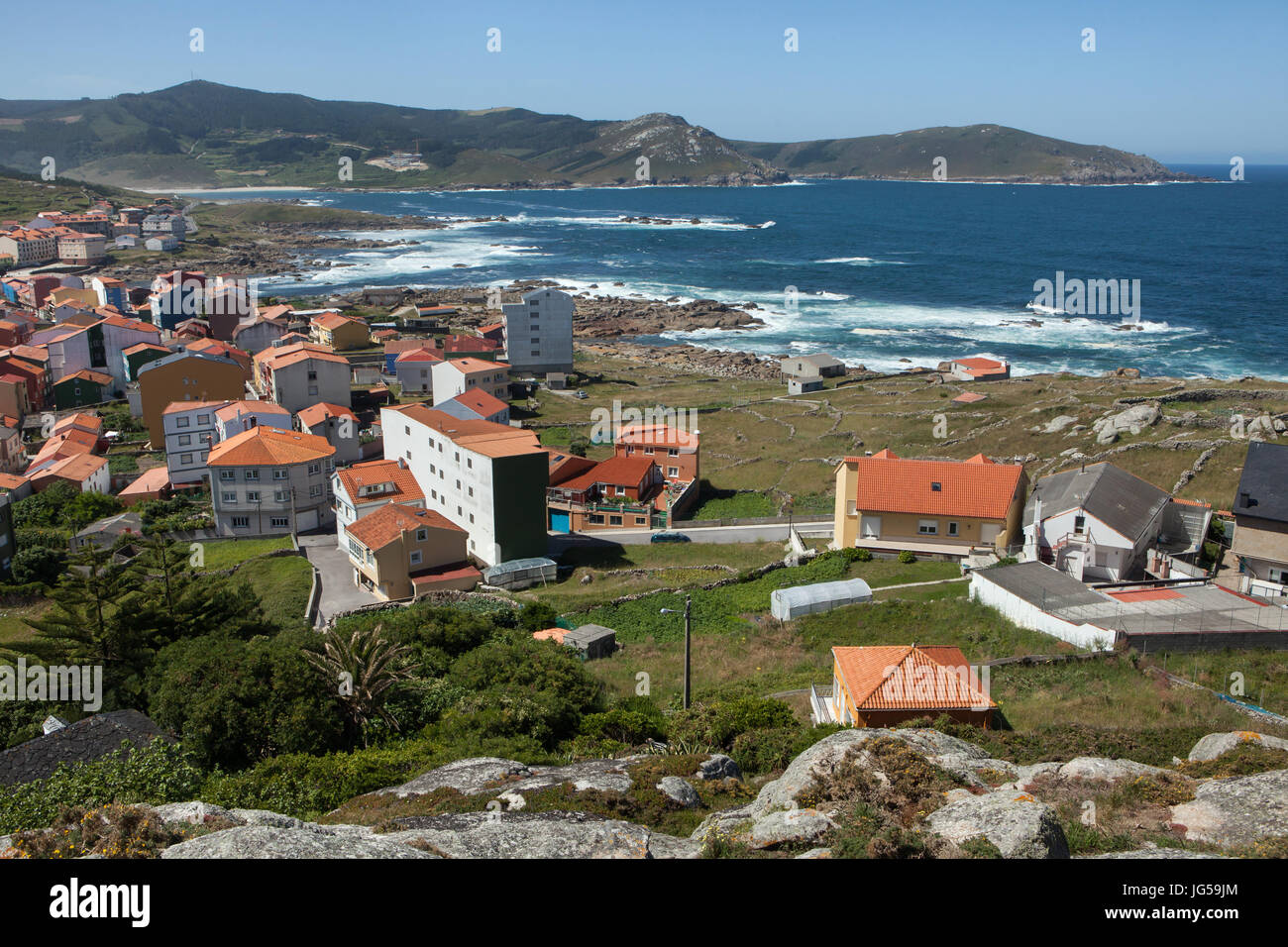 Town of Muxía on the coast of the Atlantic Ocean, known as the Costa de la Muerte (Coast of Death), pictured from Monte Corpiño in Galicia, Spain. Stock Photo