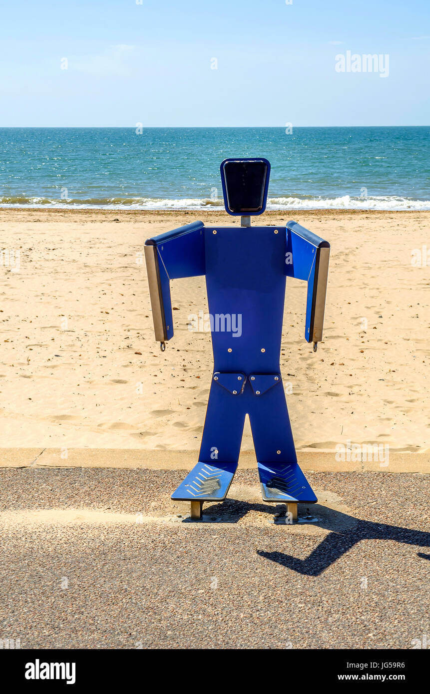 Fitness equipment at the sandy beach, blue ocean, public gym, seaside