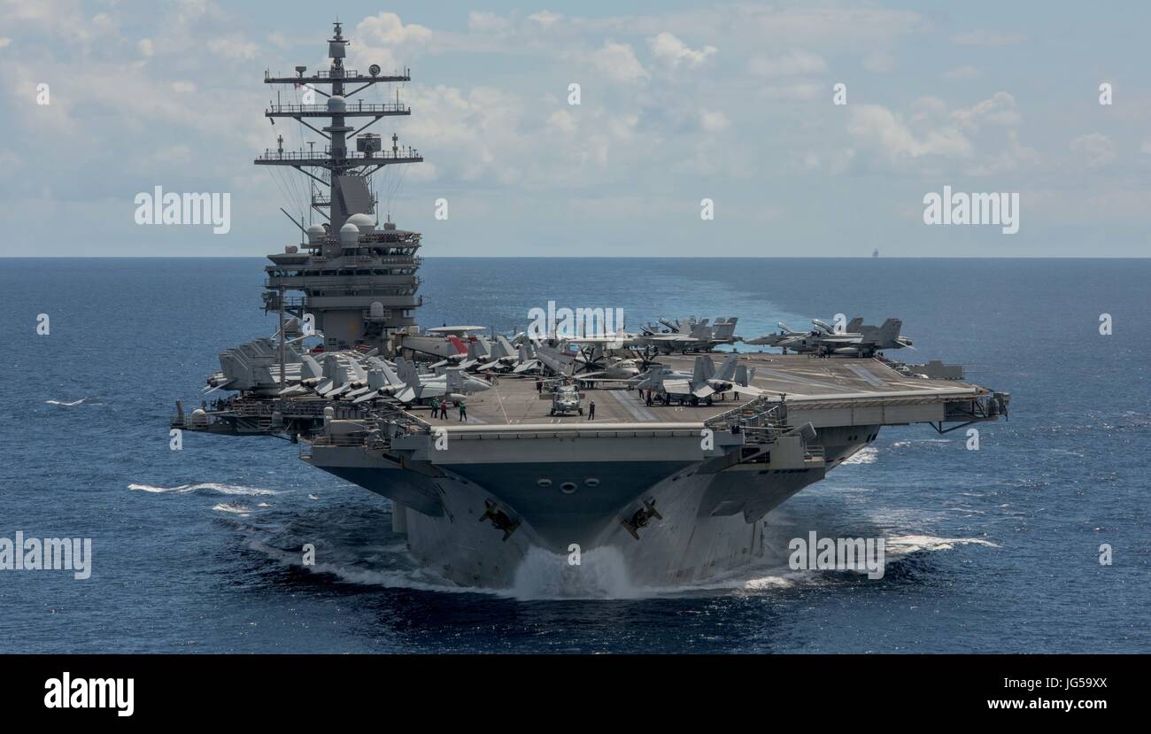 The U.S. Navy Nimitz-class aircraft carrier USS Ronald Reagan steams underway June 26, 2017 in the Pacific Ocean.    (photo by MCS2 Nathan Burke  via Planetpix) Stock Photo