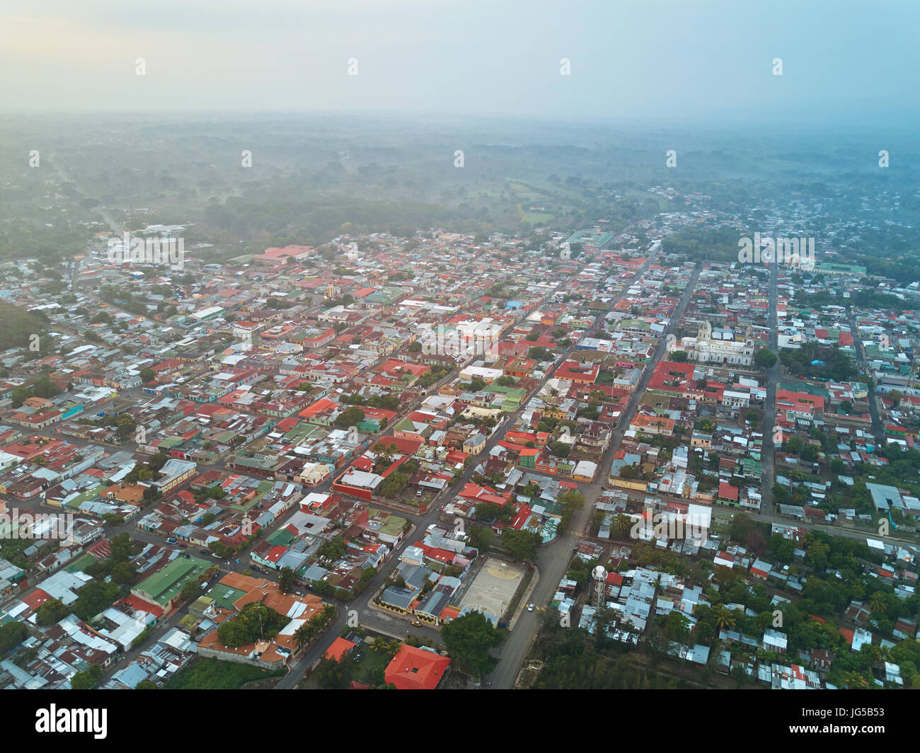 Small city blocks aerial view in morning sunrise light time. Drone view on little town Stock Photo